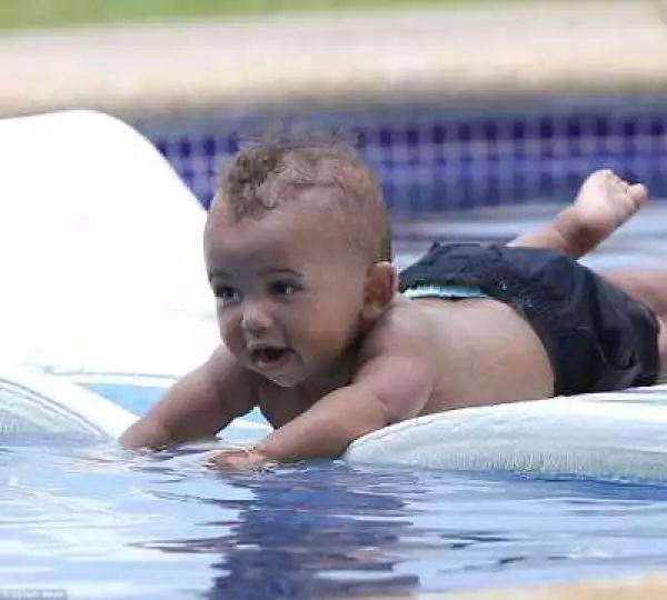 These new photos of North and Saint West enjoying pool time with Kim are too cute for words